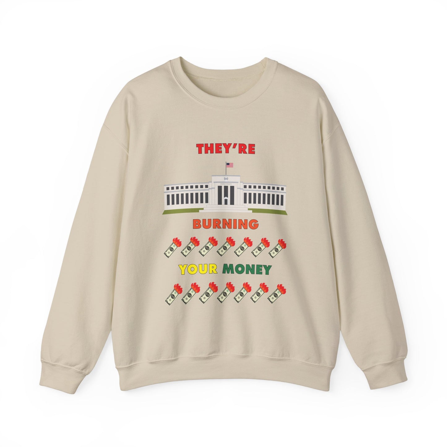 Cream crewneck sweatshirt with the words "They're Burning Your Money" in large bold letters. The design has a digital drawing of the United States Federal reserve building in Washington D.C. and it features drawings of burning dollar bills.