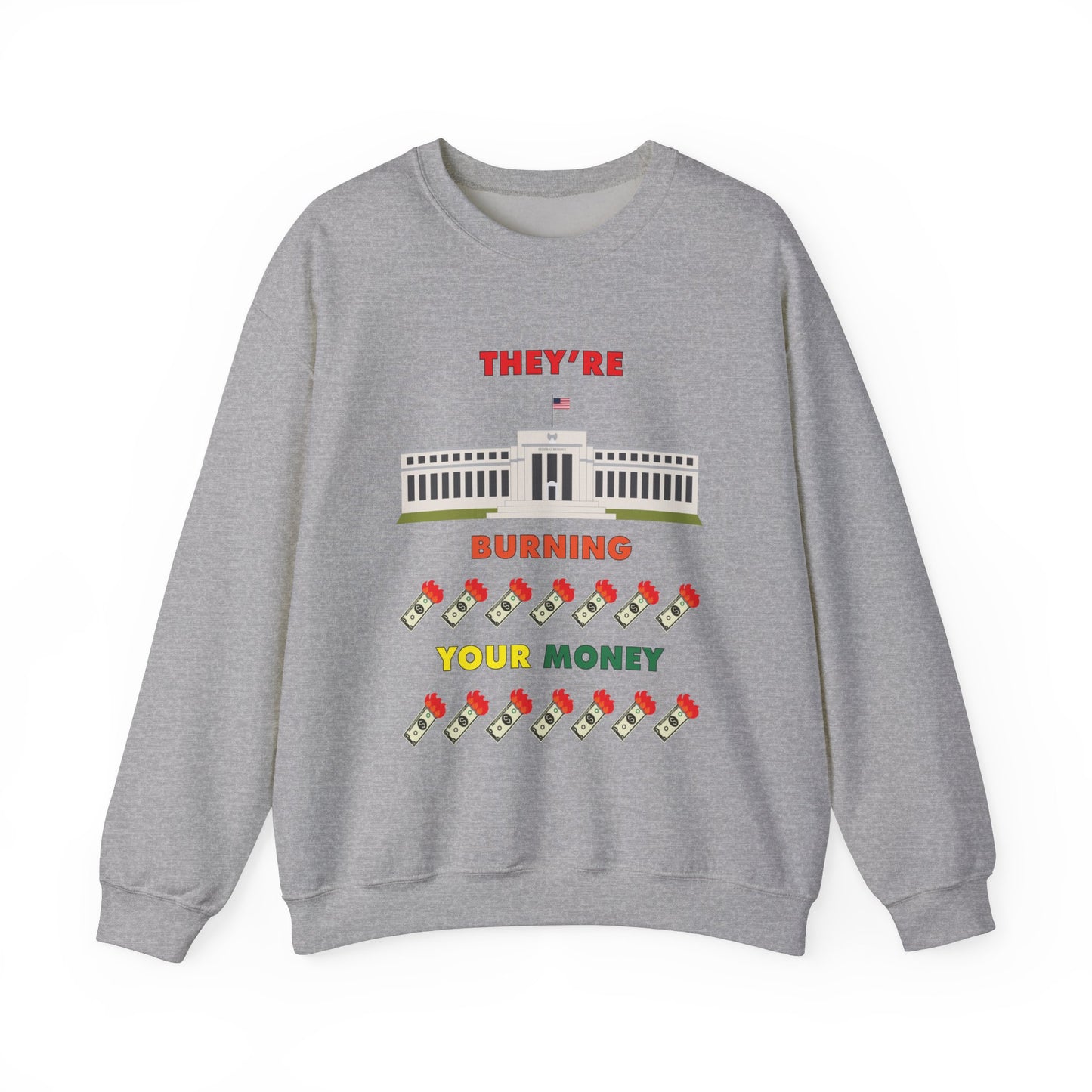 Grey crewneck sweatshirt with the words "They're Burning Your Money" in large bold letters. The design has a digital drawing of the United States Federal reserve building in Washington D.C. and it features drawings of burning dollar bills.